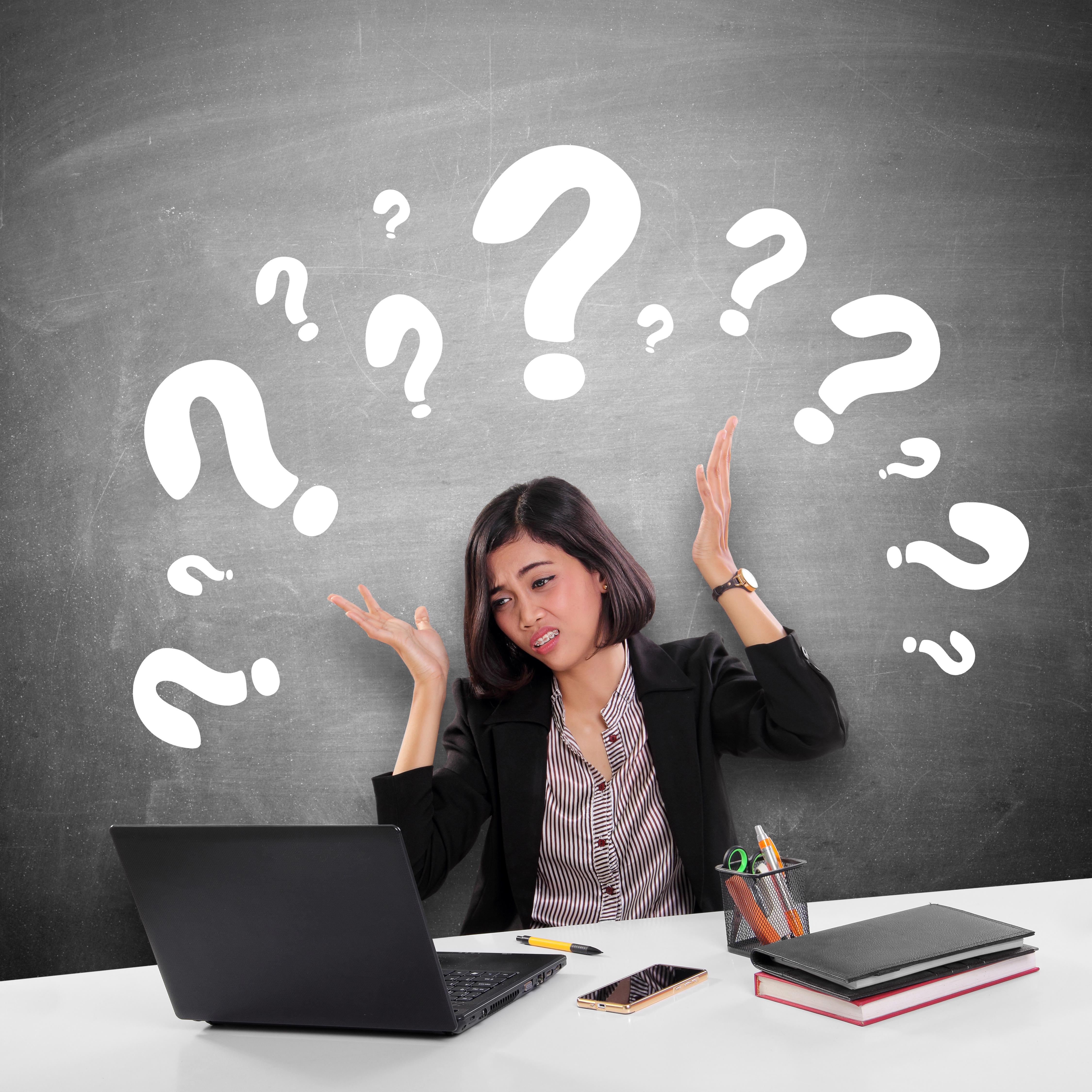 Conceptual image of a female office worker gets confused while doing her job, illustrated with many question marks above her head