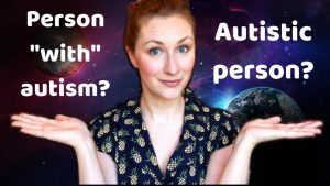 Woman holding up two hands, with "Person 'with' autism?" over one hand and "Autistic person?" over the other.